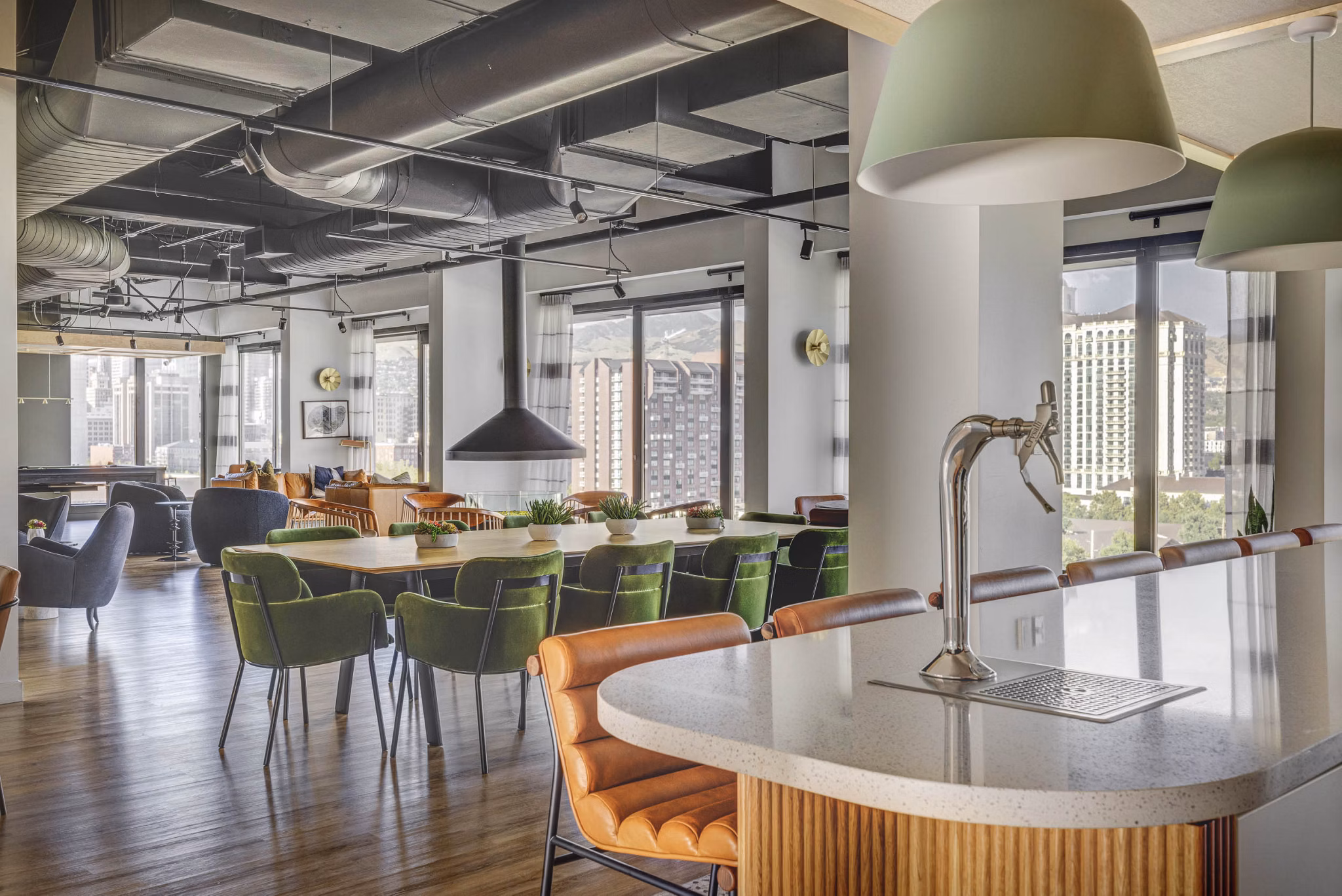 Clubhouse featuring modern lounge seating and community kitchen at Lattice Apartments