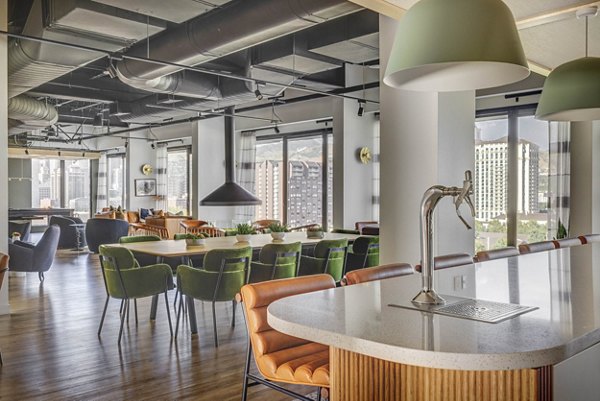 Clubhouse featuring modern lounge seating and community kitchen at Lattice Apartments