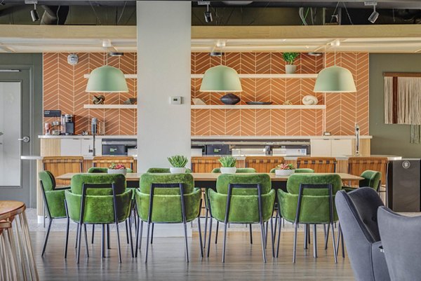 Welcoming clubhouse with plush seating at Lattice Apartments, ideal for social gatherings and relaxation