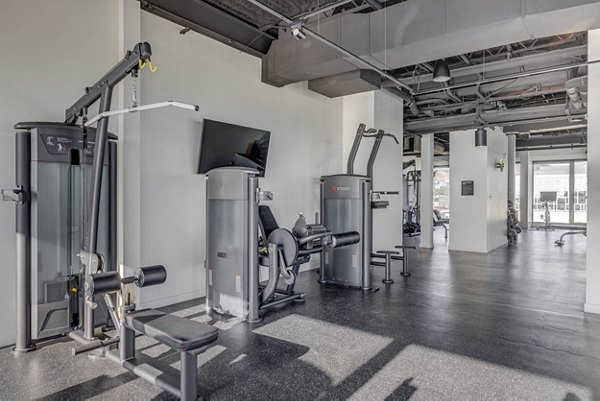 Fitness center with state-of-the-art equipment at Lattice Apartments, offering luxury amenities for residents seeking an active lifestyle