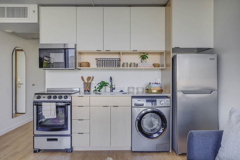 Contemporary kitchen with stainless steel appliances in Lattice Apartments