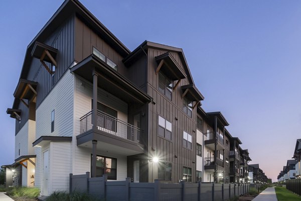 Building at Citizen House Bergstrom Apartments featuring a modern design with luxury amenities in Austin, TX