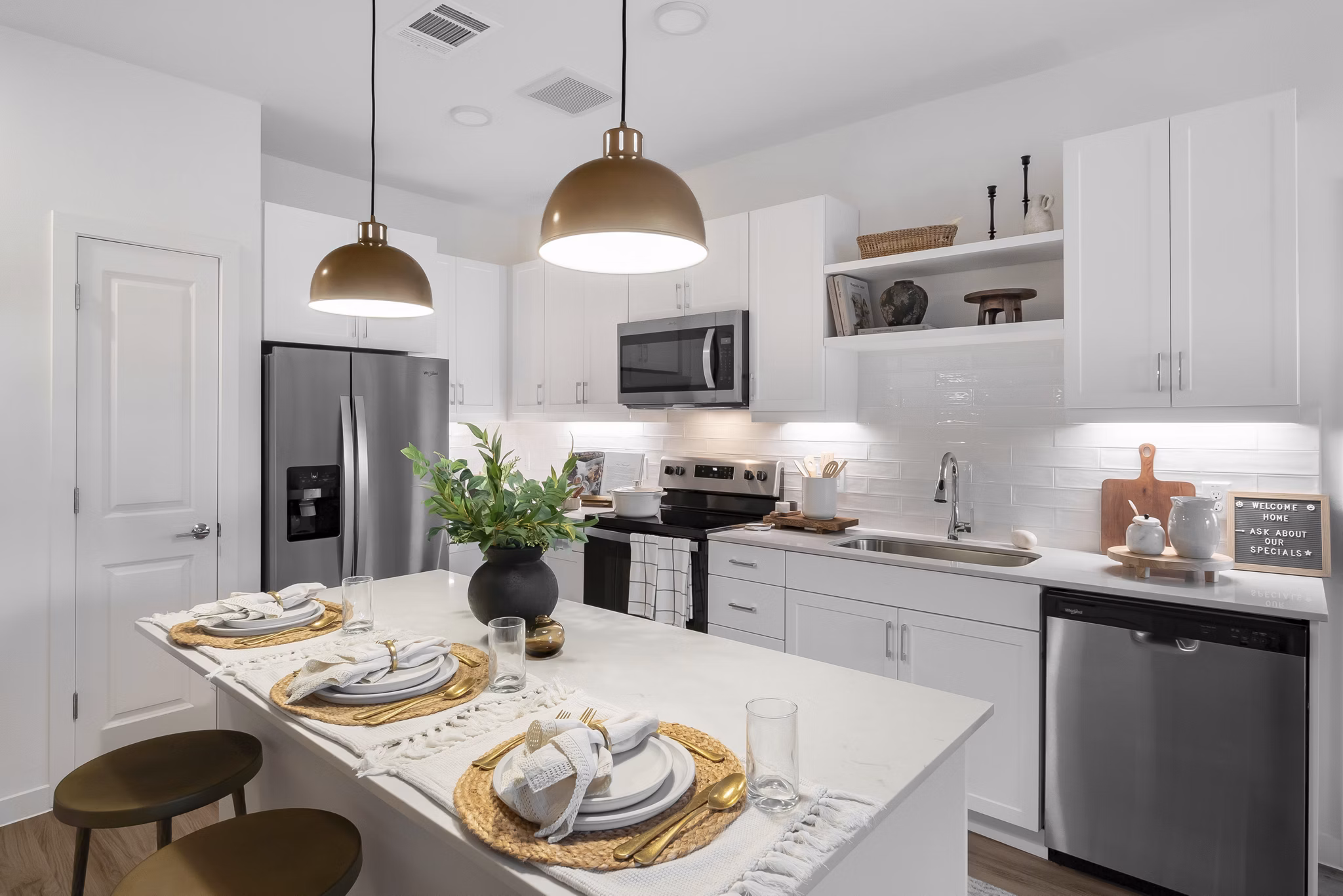 Modern kitchen with stainless steel appliances at Citizen House Bergstrom luxury apartments