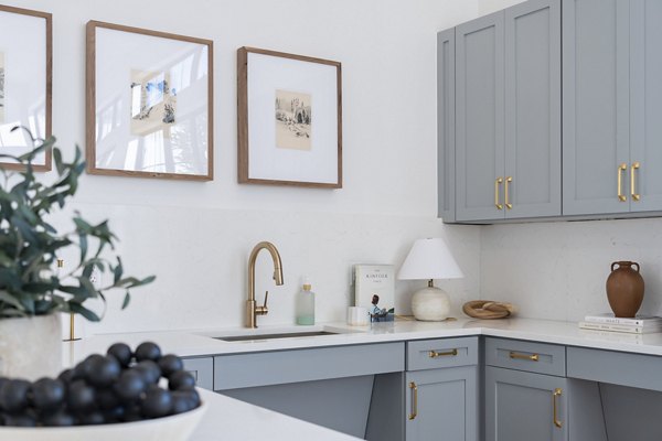 Modern kitchen with stainless steel appliances at Citizen House Bergstrom Apartments, offering luxury living in a premium location