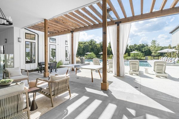 Modern outdoor patio with comfortable seating at Citizen House Bergstrom Apartments for luxurious living