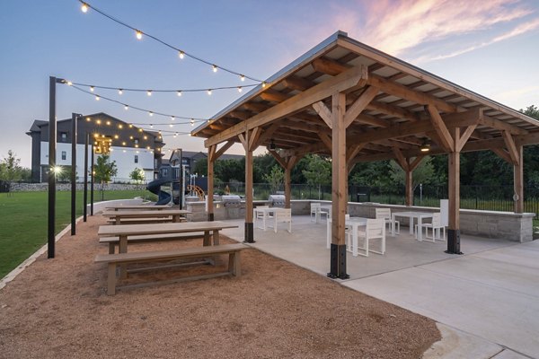 Modern recreational area with gaming zones at Citizen House Bergstrom Apartments
