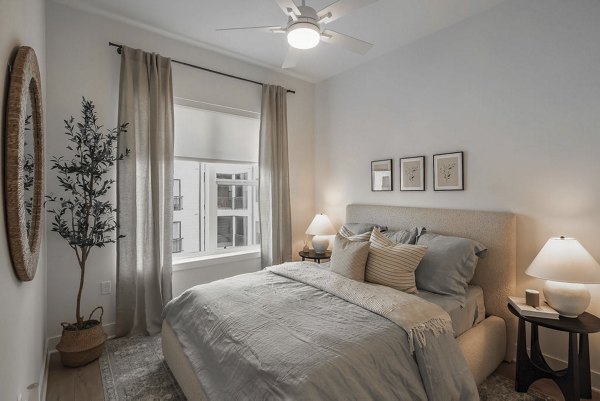 Modern bedroom with elegant decor in Solomon Apartments