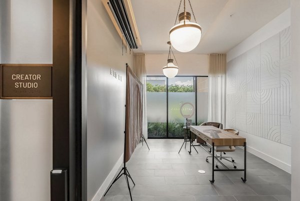 Home office with modern desk and ergonomic chair in Solomon Apartments