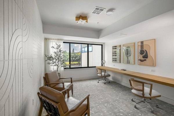 Home office with ergonomic desk and chair at Solomon Apartments