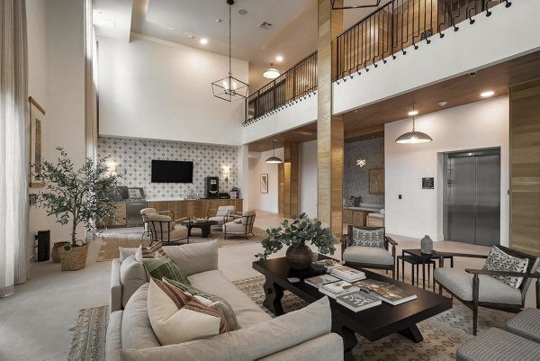 Spacious lobby featuring modern decor and seating at Solomon Apartments