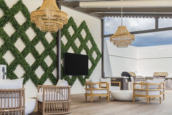 Solomon Apartments: Welcoming clubhouse with modern decor and comfortable seating, perfect for community gatherings at Greystar's luxury apartments