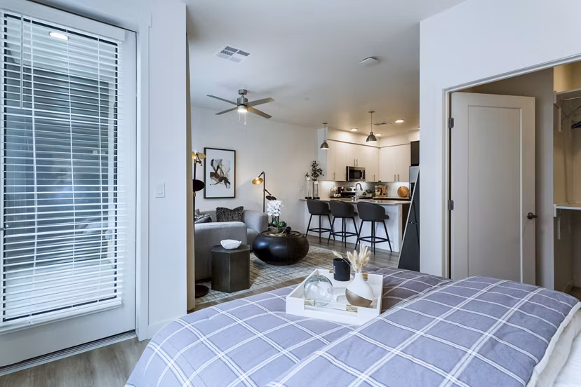 Cozy bedroom with modern decor at Markana Uptown Apartments with luxury living features