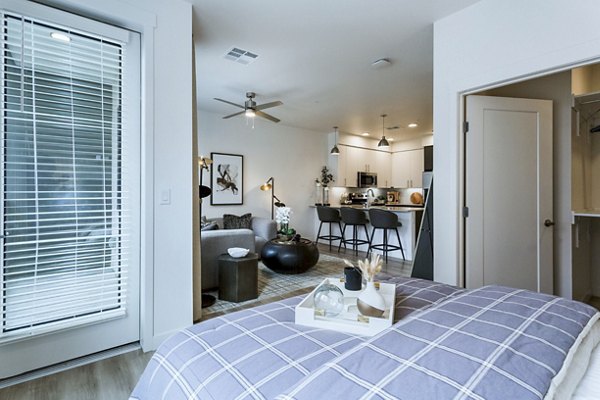 Cozy bedroom with modern decor at Markana Uptown Apartments with luxury living features