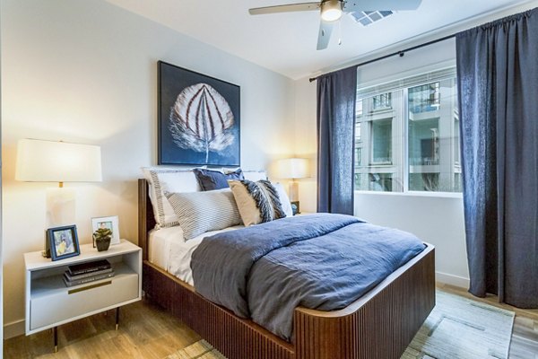 Modern bedroom with sleek furnishings at Markana Uptown Apartments