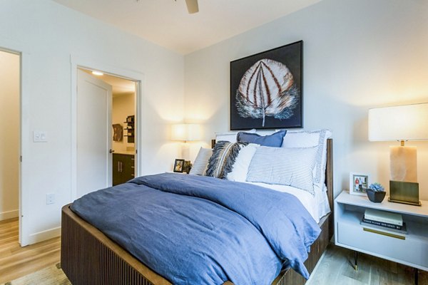 Contemporary bedroom with ample natural light in Markana Uptown Apartments