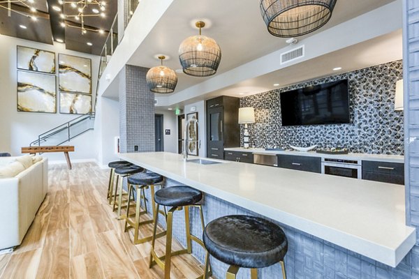 Clubhouse featuring modern decor and comfortable seating at Markana Uptown Apartments, a Greystar luxury community