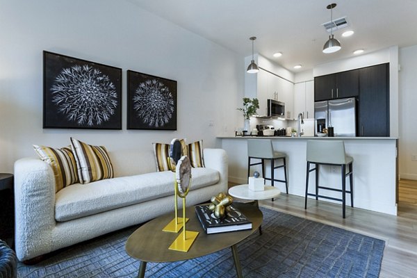 Modern living room with sleek furnishings at Markana Uptown Apartments, luxury apartment in vibrant urban setting