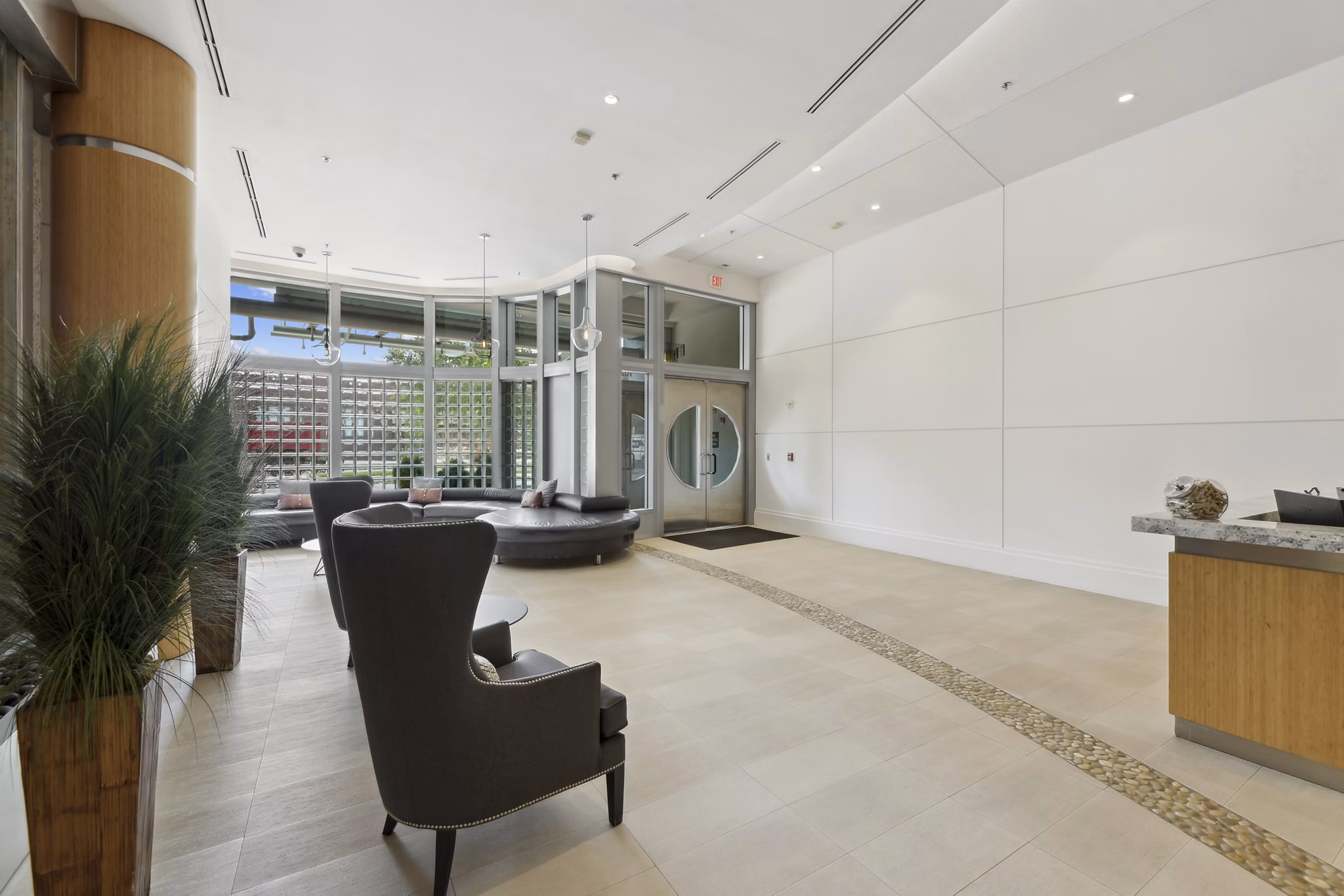 Clubhouse featuring a modern lounge and seating area at Jasper Columbia Pike Apartments