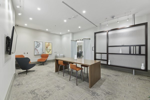 Clubhouse with luxurious seating and entertainment spaces at Jasper Columbia Pike Apartments