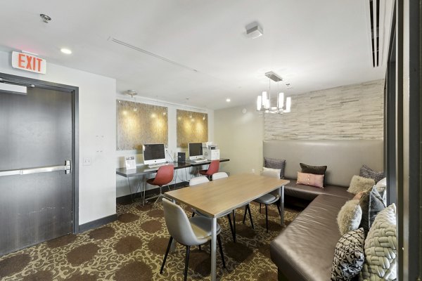 Elegant business center with modern workstations at Jasper Columbia Pike Apartments