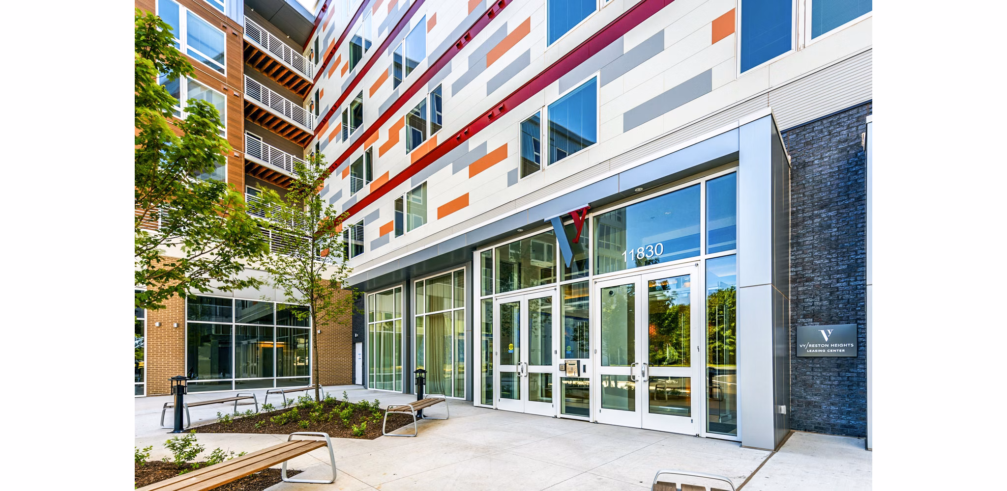 Clubhouse at VY Reston Heights Apartments: Modern community space with cozy seating areas and contemporary design for socializing and relaxation