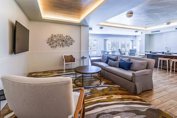 Clubhouse featuring stylish furnishings and entertainment spaces at VY Reston Heights Apartments