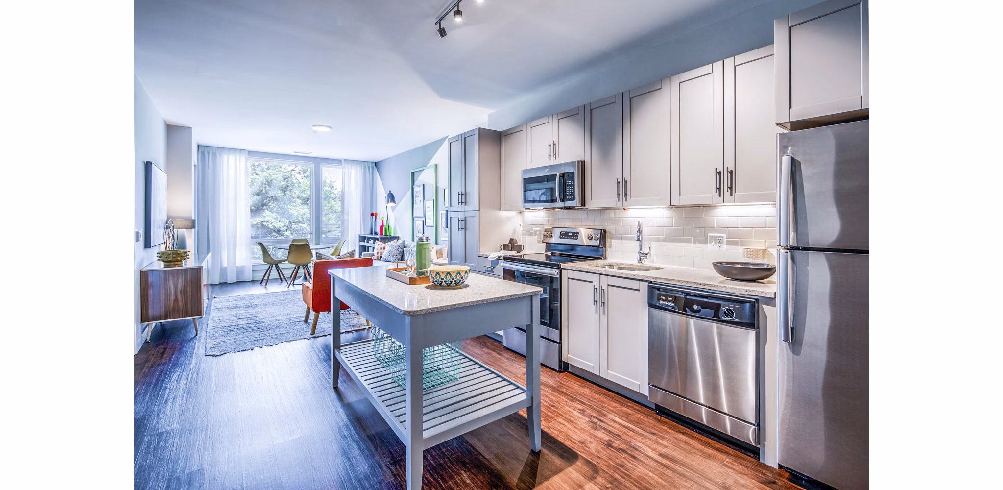Modern kitchen with stainless steel appliances and granite countertops in VY Reston Heights Apartments