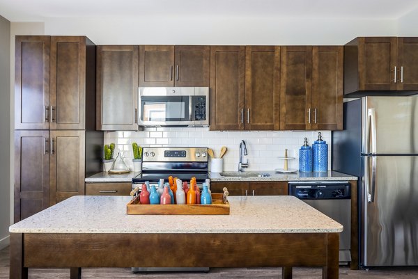 Modern kitchen with stainless steel appliances in VY Reston Heights Apartments