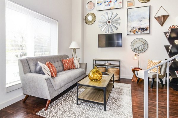 Living room featuring modern decor and ample natural light at VY Reston Heights luxury apartments
