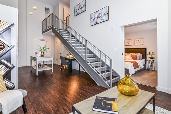 Spacious living room with modern decor and large windows in VY Reston Heights apartments