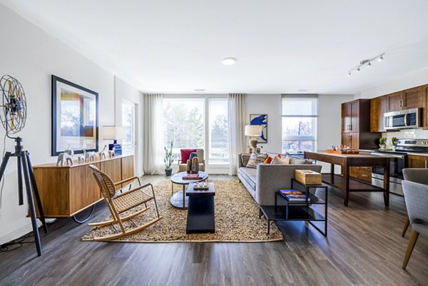 Cozy living room with modern decor and ample natural light in VY Reston Heights apartments