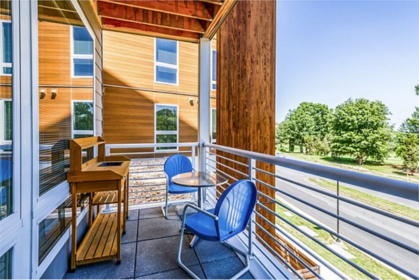 Private patio with modern furniture at VY Reston Heights Apartments