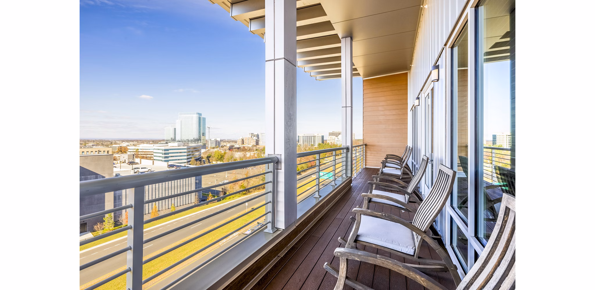 Outdoor clubhouse patio with modern seating at VY Reston Heights Apartments, ideal for relaxation and entertainment