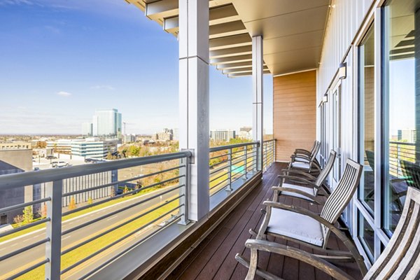 Outdoor clubhouse patio with modern seating at VY Reston Heights Apartments, ideal for relaxation and entertainment