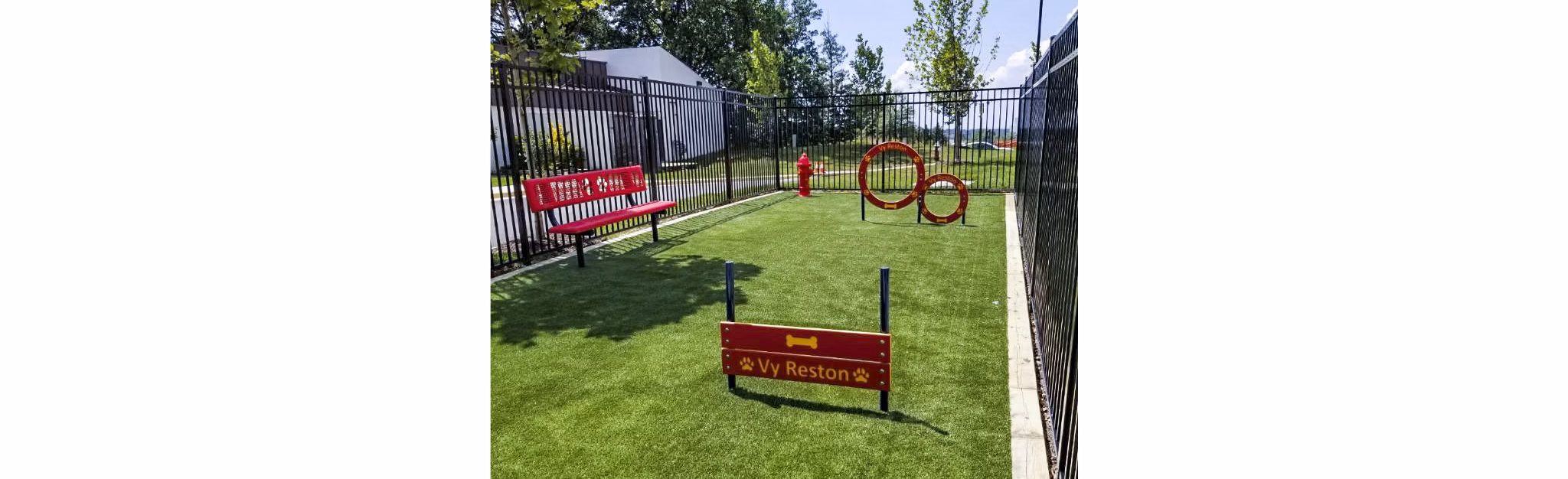 Dog park with agility equipment at VY Reston Heights Apartments