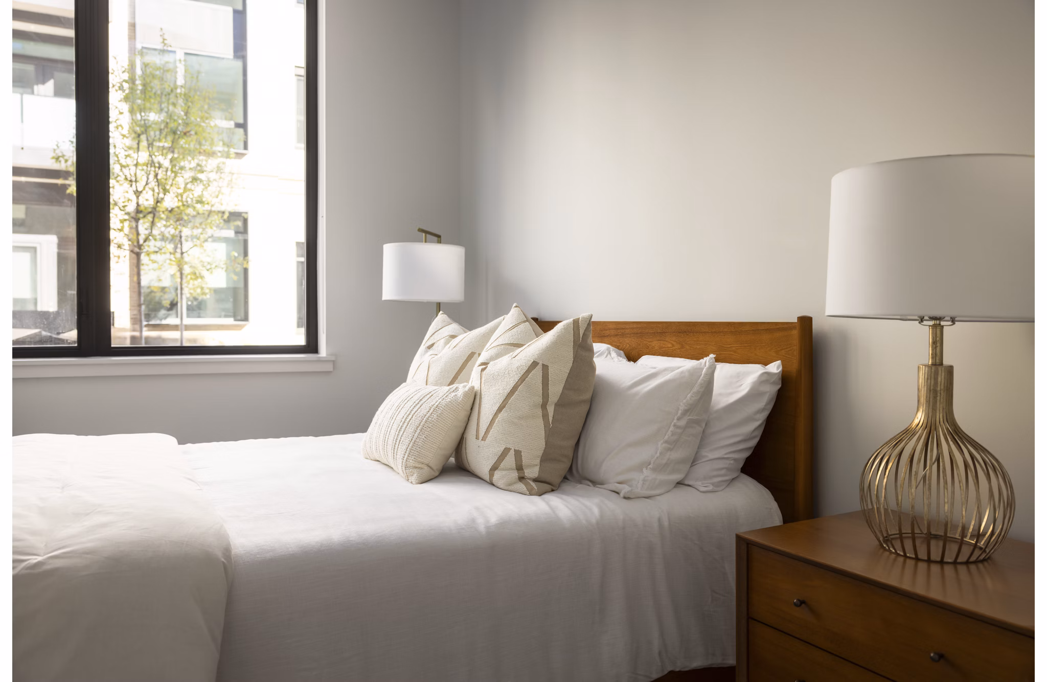 Bluff at Boulder Commons: Cozy bedroom with modern design elements and ambient lighting in luxury Greystar apartments