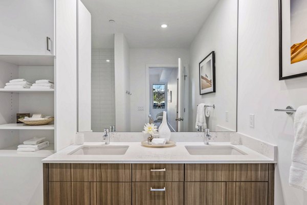 Modern bathroom with marble countertops at Bluff at Boulder Commons Apartments, offering luxury living in a Greystar community