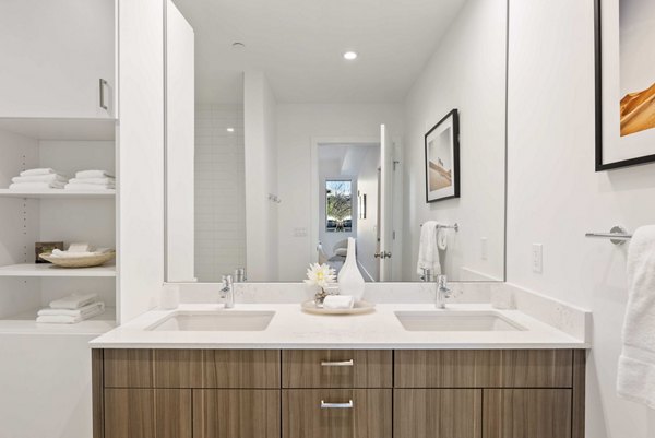 Modern bathroom with sleek fixtures at Bluff at Boulder Commons Apartments