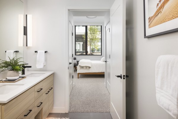Modern bathroom with sleek fixtures at Bluff at Boulder Commons Apartments, luxury living by Greystar