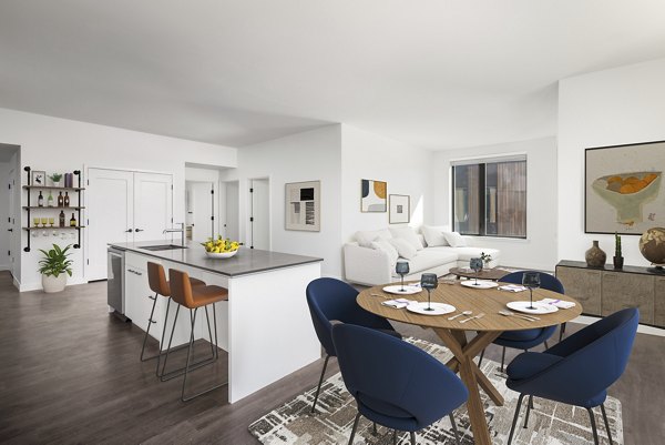 Dining area with modern decor and open floor plan in Bluff at Boulder Commons Apartments