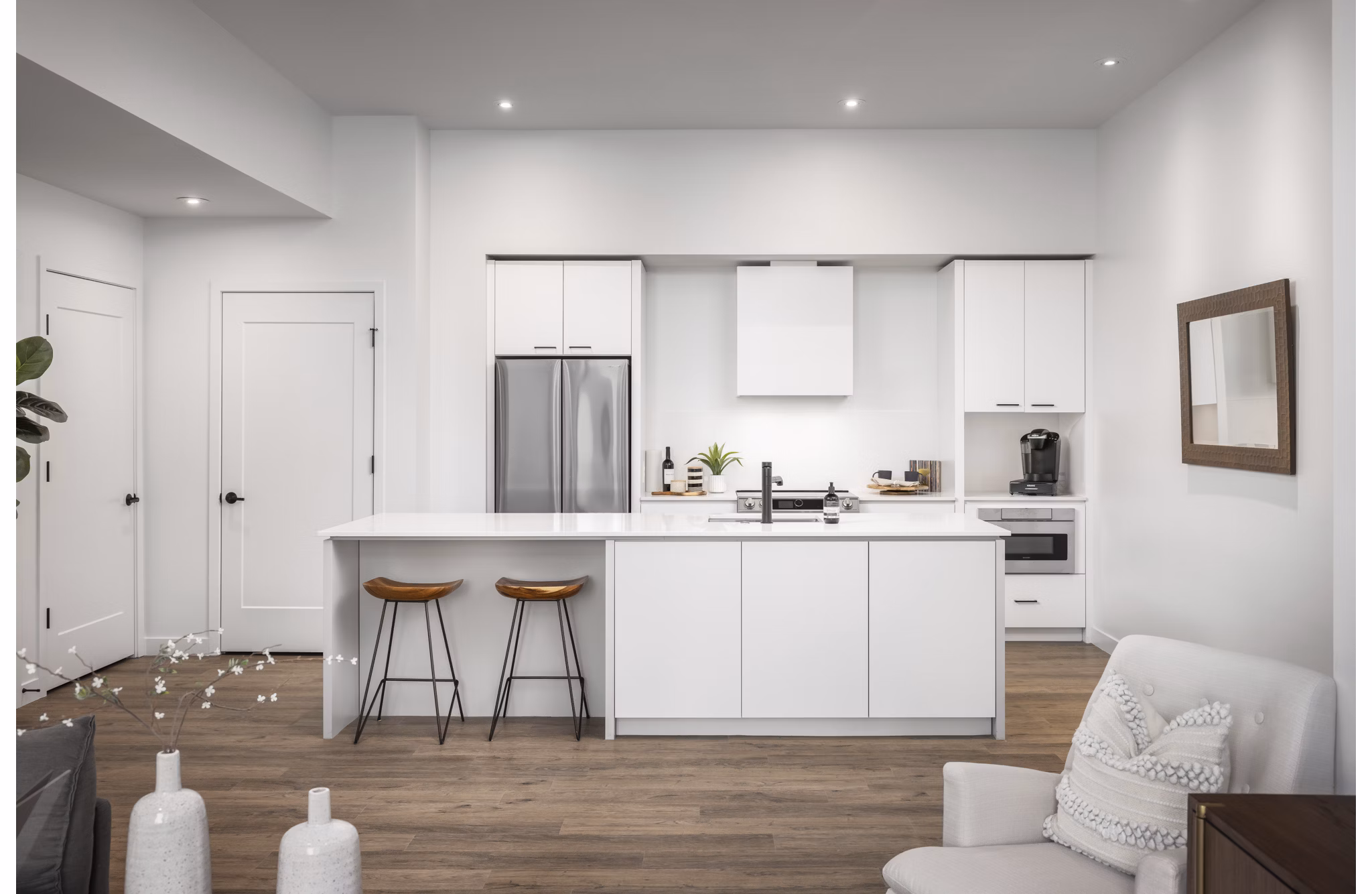 Modern kitchen with stainless steel appliances in Bluff at Boulder Commons Apartments