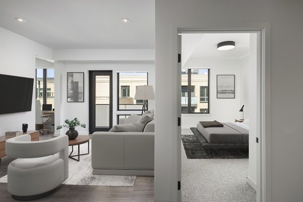 Modern kitchen featuring stainless steel appliances at Bluff at Boulder Commons Apartments