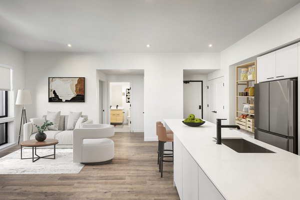 Modern kitchen with stainless steel appliances at Bluff at Boulder Commons Apartments