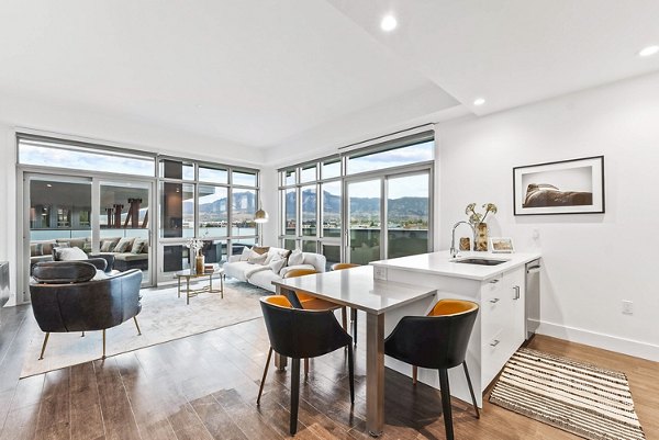 Modern kitchen with stainless steel appliances in Bluff at Boulder Commons Apartments
