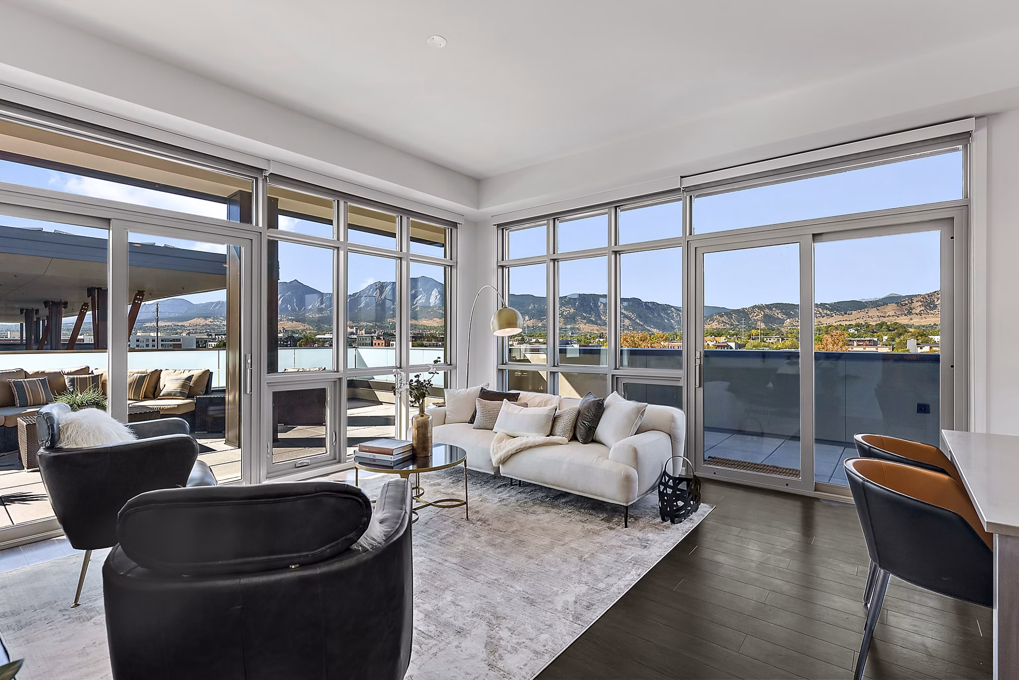 Spacious living room with modern furnishings at Bluff at Boulder Commons Apartments