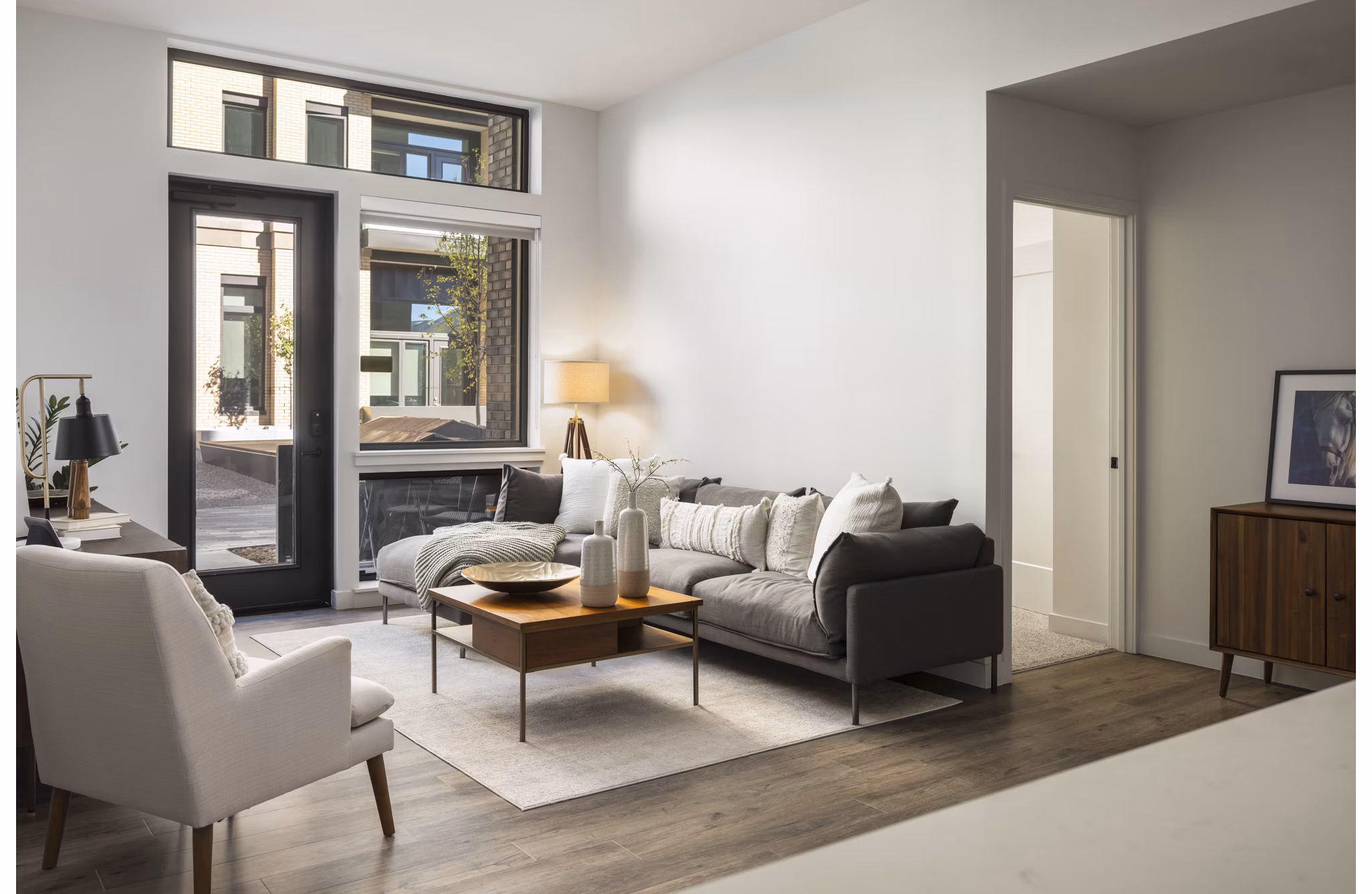 Spacious living room with modern decor in Bluff at Boulder Commons Apartments, offering luxury comfort and style