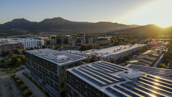 Bluff at Boulder Commons: Scenic view of luxury apartments nestled in a serene environment