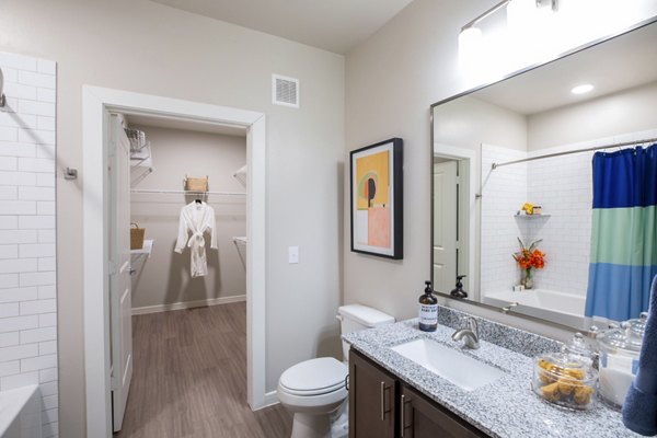 Modern bathroom with sleek fixtures and marble countertops at Allora Alamo Heights Apartments