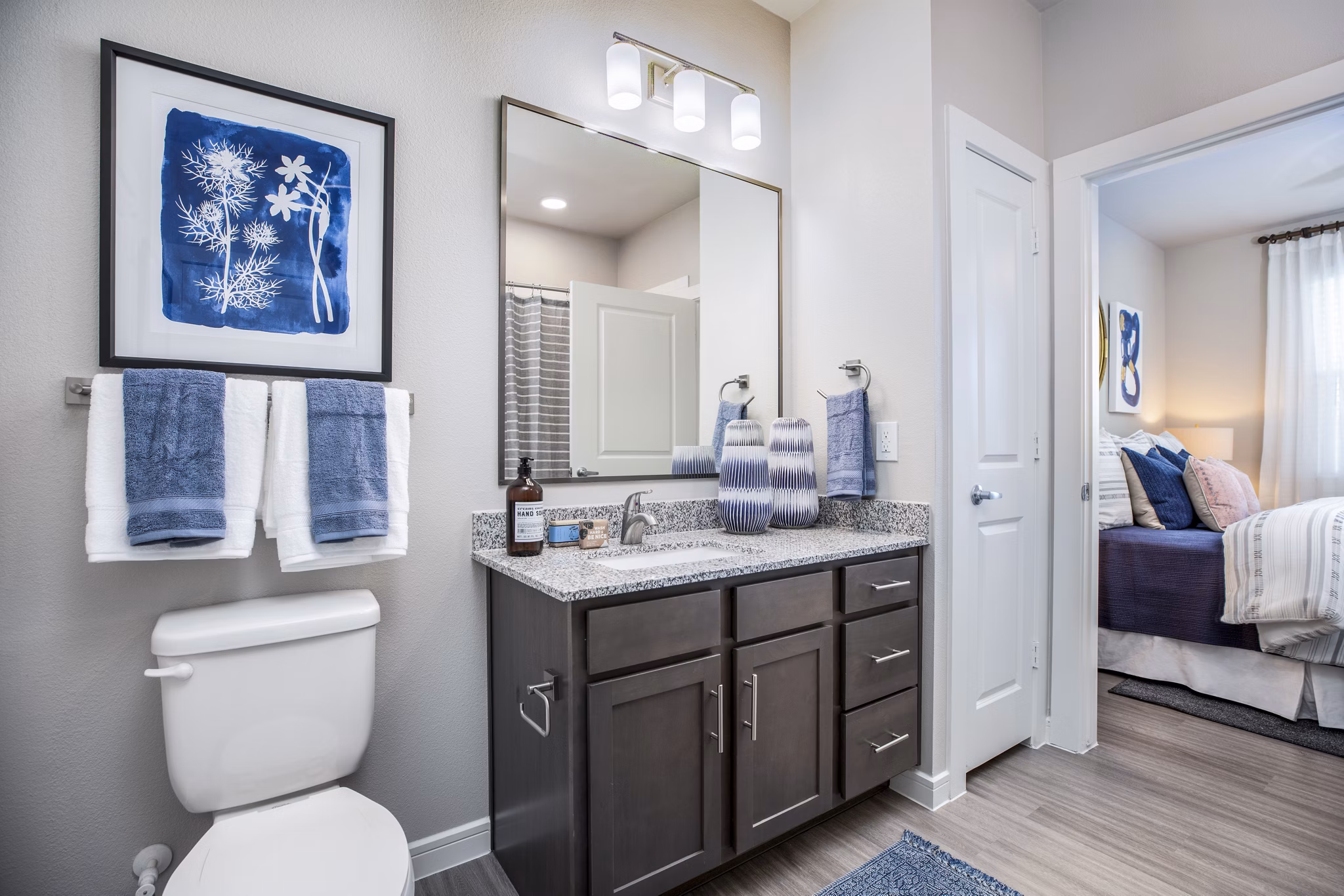Modern bathroom featuring sleek fixtures and marble countertops in Allora Alamo Heights Apartments