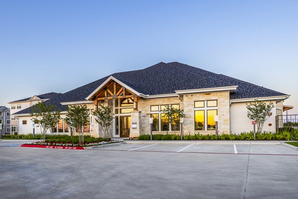 Clubhouse featuring modern design and seating area at Allora Alamo Heights Apartments